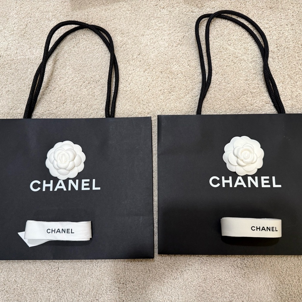 CHANEL Black Bags with White Camellia Accent